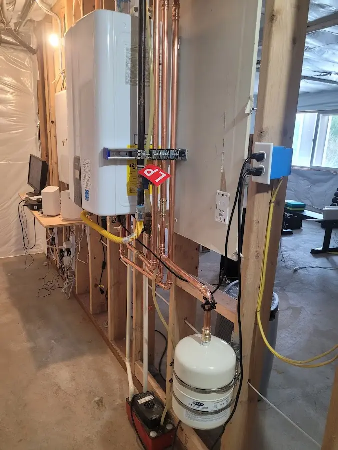 Licensed plumber repairing a kitchen sink in Tenafly
