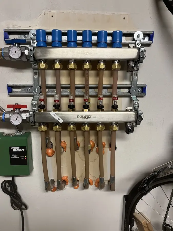 Plumber performing Water Heater Repair at a residential property in Tenafly